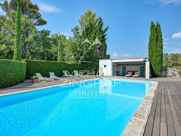 Swimming pool surrounded by greenery in a 19th century Provençal country house in Jouques.