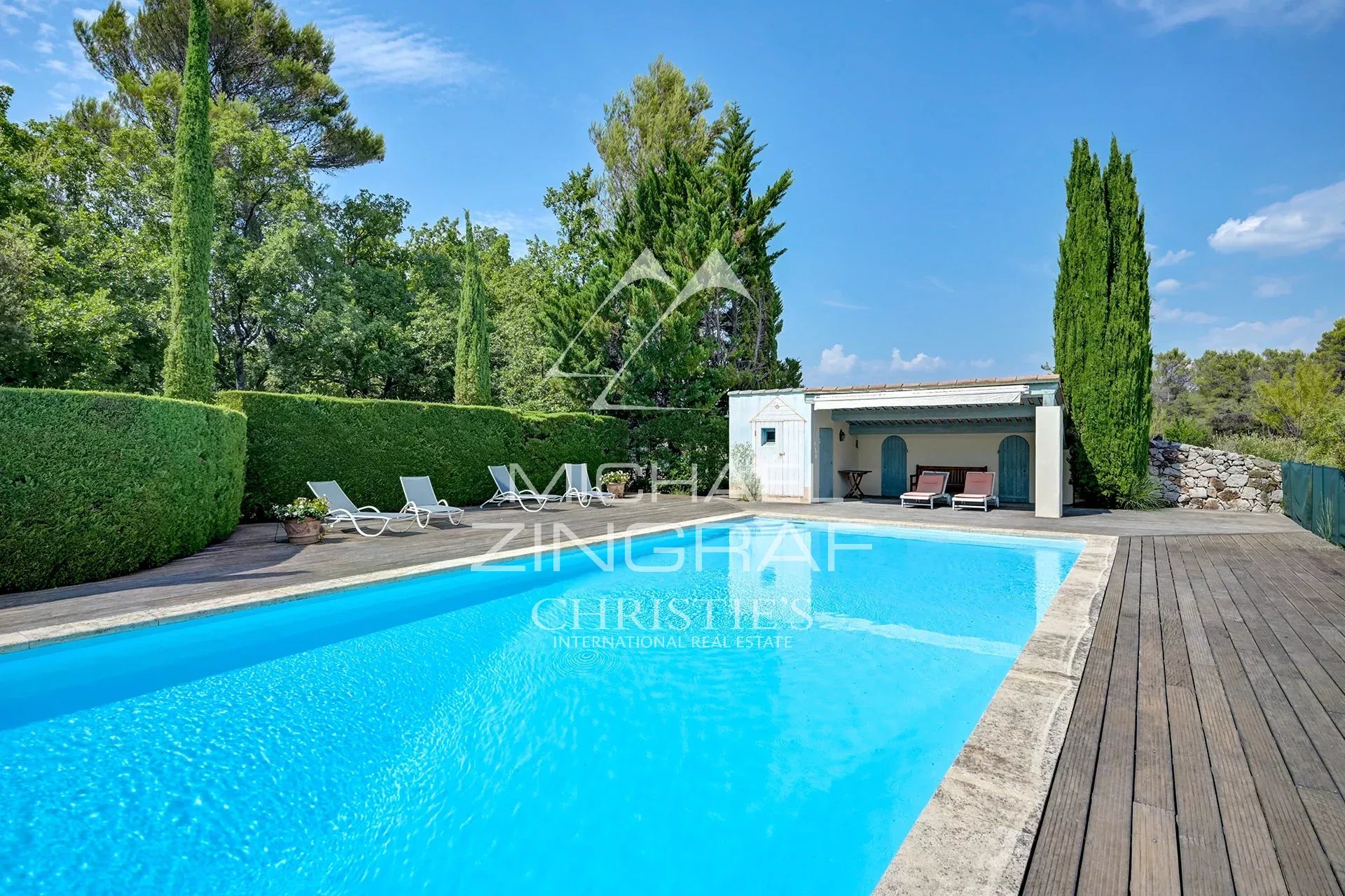 Swimming pool of a Provençal country house Swimming pool surrounded by greenery in a 19th century Provençal country house in Jouques.