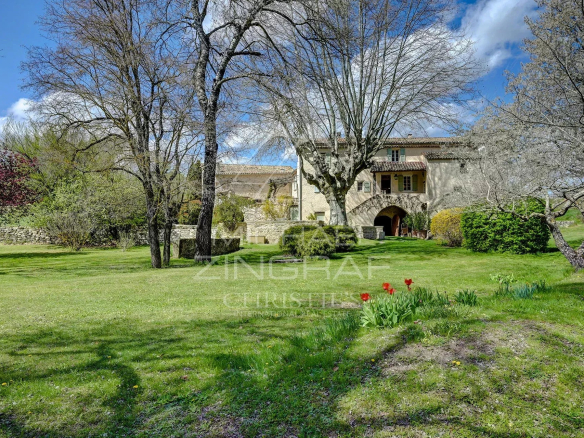 A renovated 17th-century mill in a green park in Forcalquier