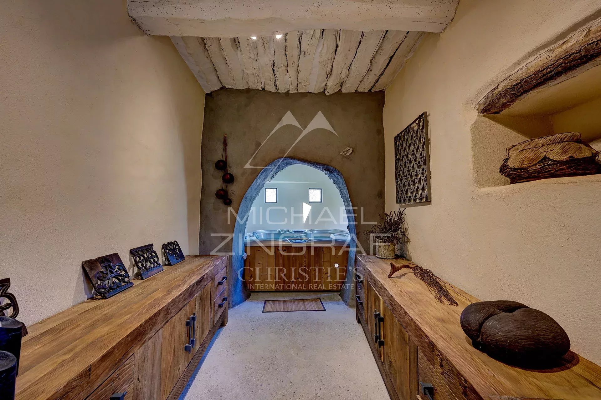 Interior of a renovated 17th-century mill, with stone walls and wooden furniture.