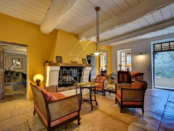 Interior of a renovated 17th-century mill with a warm living room and elegant decorative elements.
