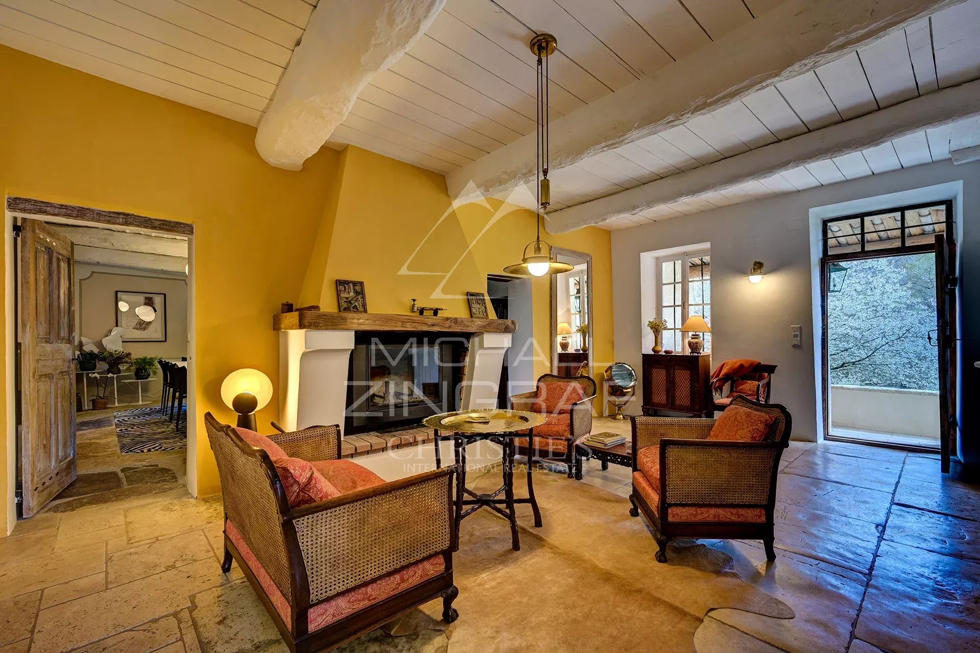 Interior of a renovated 17th-century mill with a warm living room and elegant decorative elements.