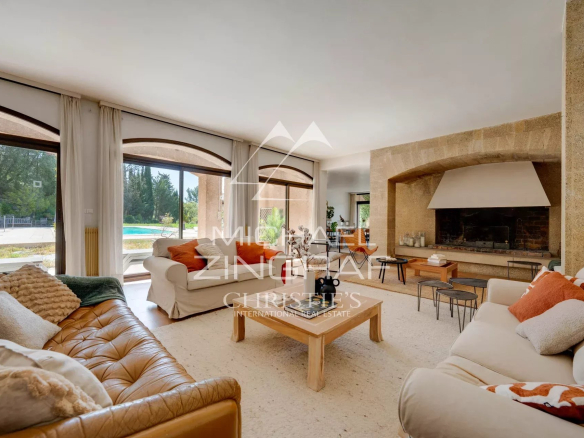 Interior of a 1970s house with a bright living room and fireplace, overlooking the park.