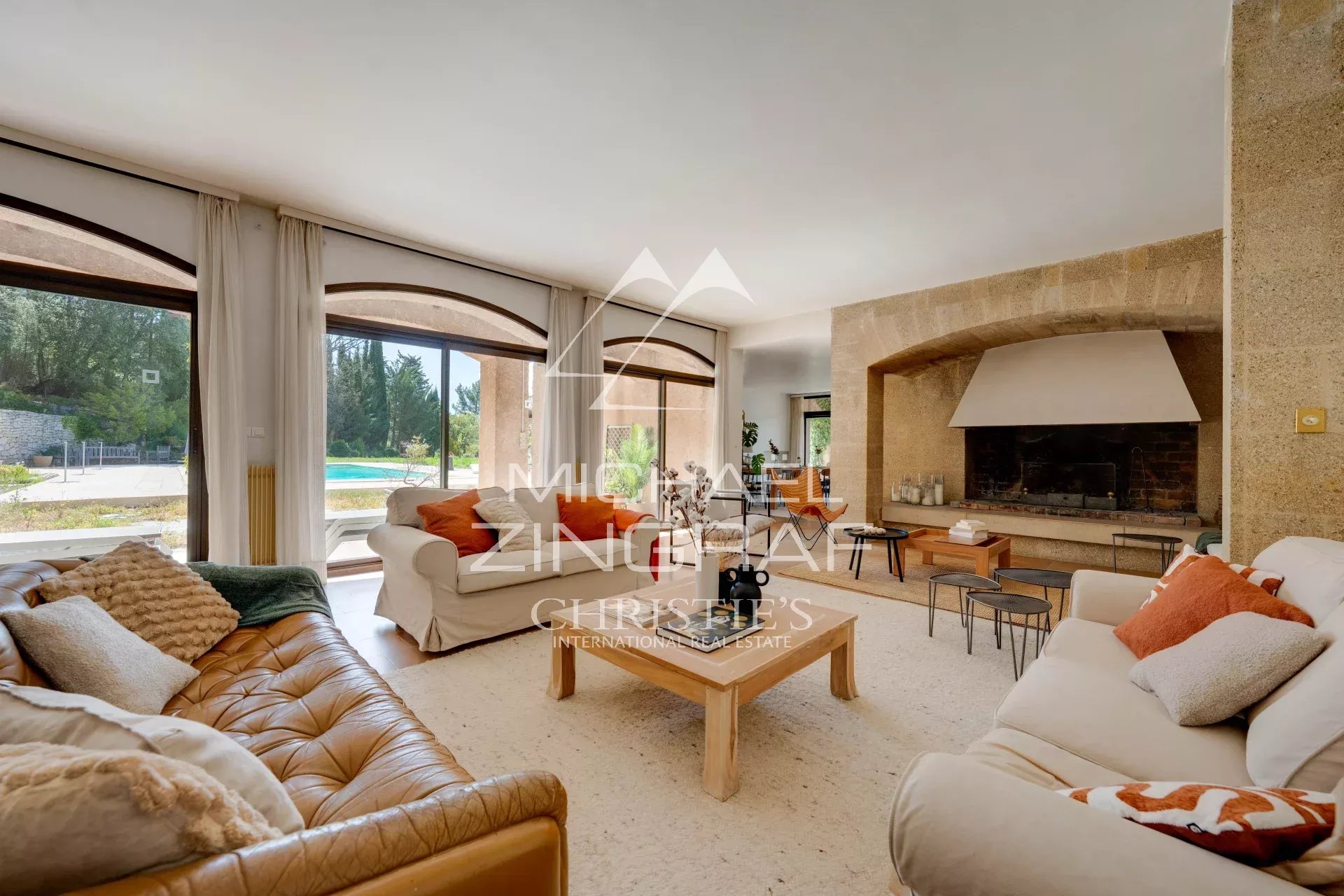 Living room of a 1970s property Interior of a 1970s house with a bright living room and fireplace, overlooking the park.