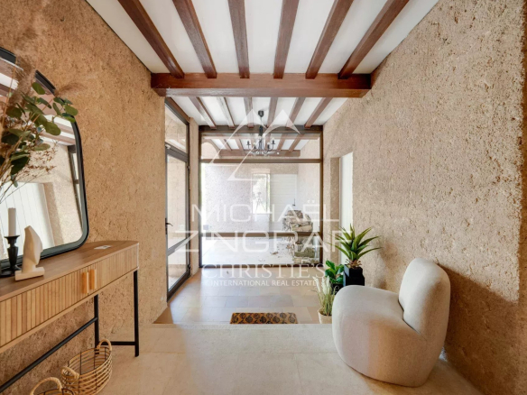 Interior of a 1970s property with stone walls and modern decor.