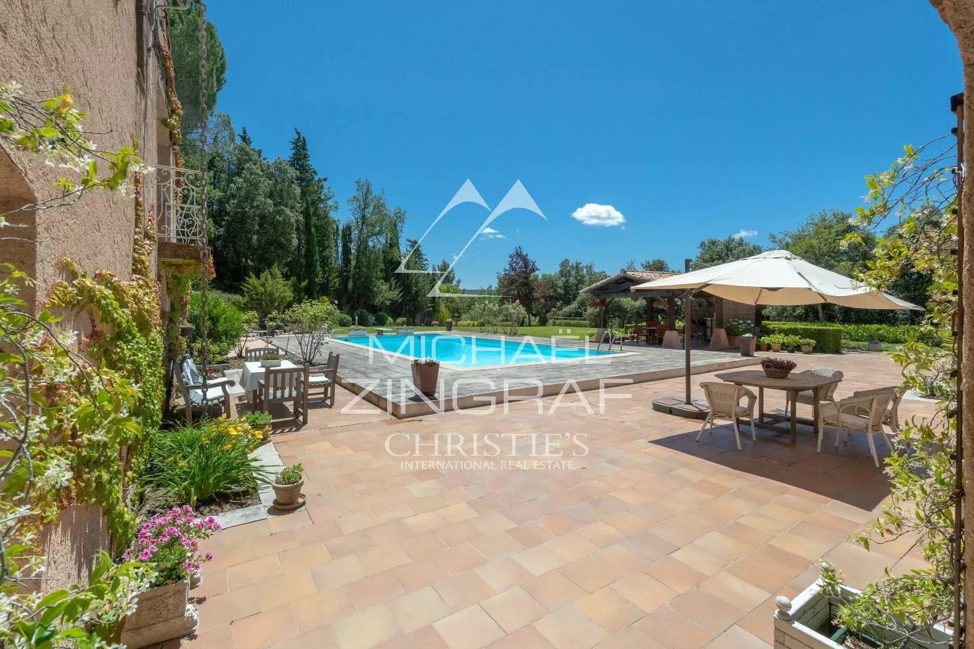 Terrace with swimming pool in Rians Sunny terrace with swimming pool and parasol in a 2.7 hectare park near Aix-en-Provence.