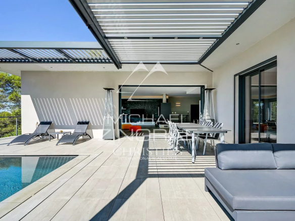 Terrace of a contemporary villa with swimming pool and modern furniture in Aix-en-Provence.