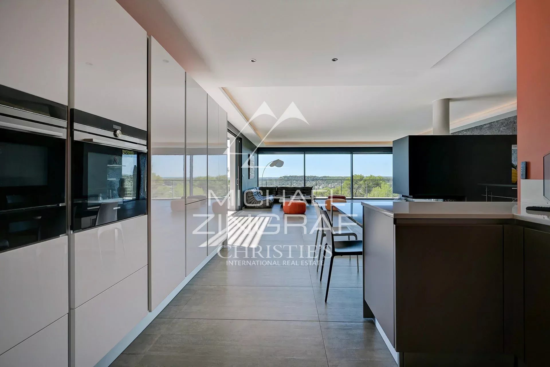 Modern kitchen of a contemporary villa Interior of a contemporary villa with modern kitchen and panoramic views of nature.