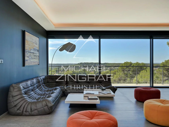 Interior of a contemporary villa with panoramic views and modern furniture in Aix-en-Provence.