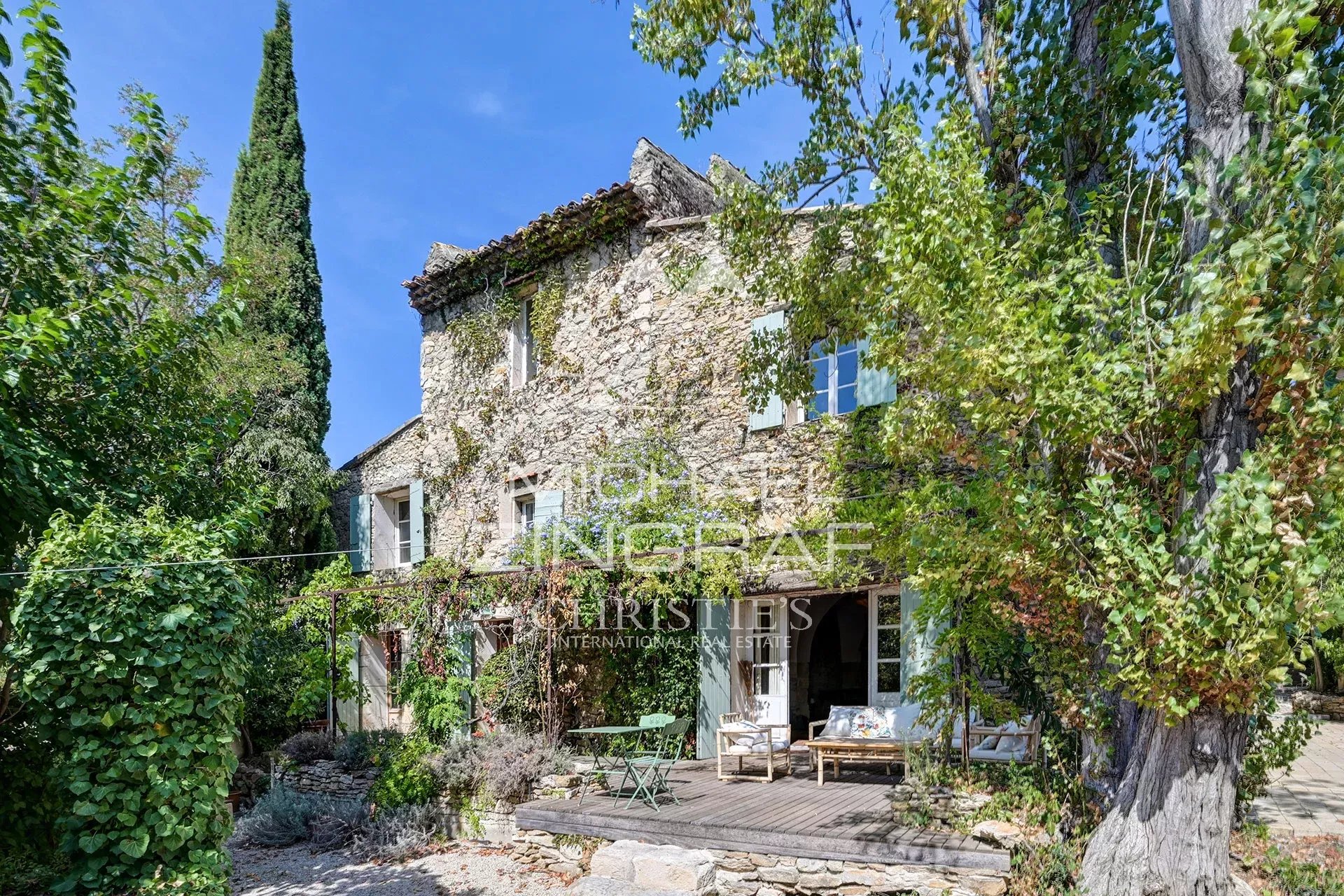 Renovated silkworm farm in La Fare-les-Oliviers Renovated stone house with garden, surrounded by trees, in La Fare-les-Oliviers.