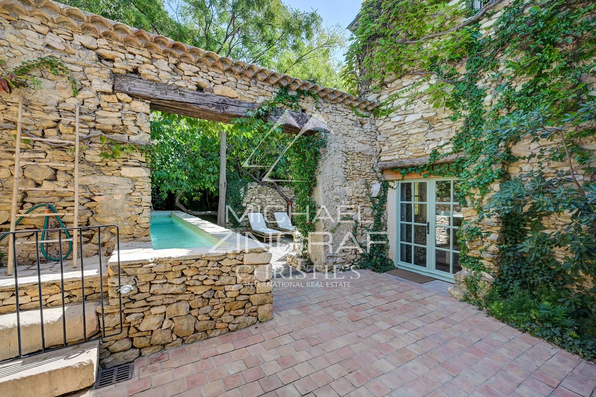 Renovated silkworm farm in Provence View of a renovated silkworm farm with swimming pool and stone walls, La Fare-les-Oliviers, Provence.