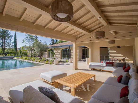 Terrace of a renovated stone house with swimming pool in Maussane-les-Alpilles.