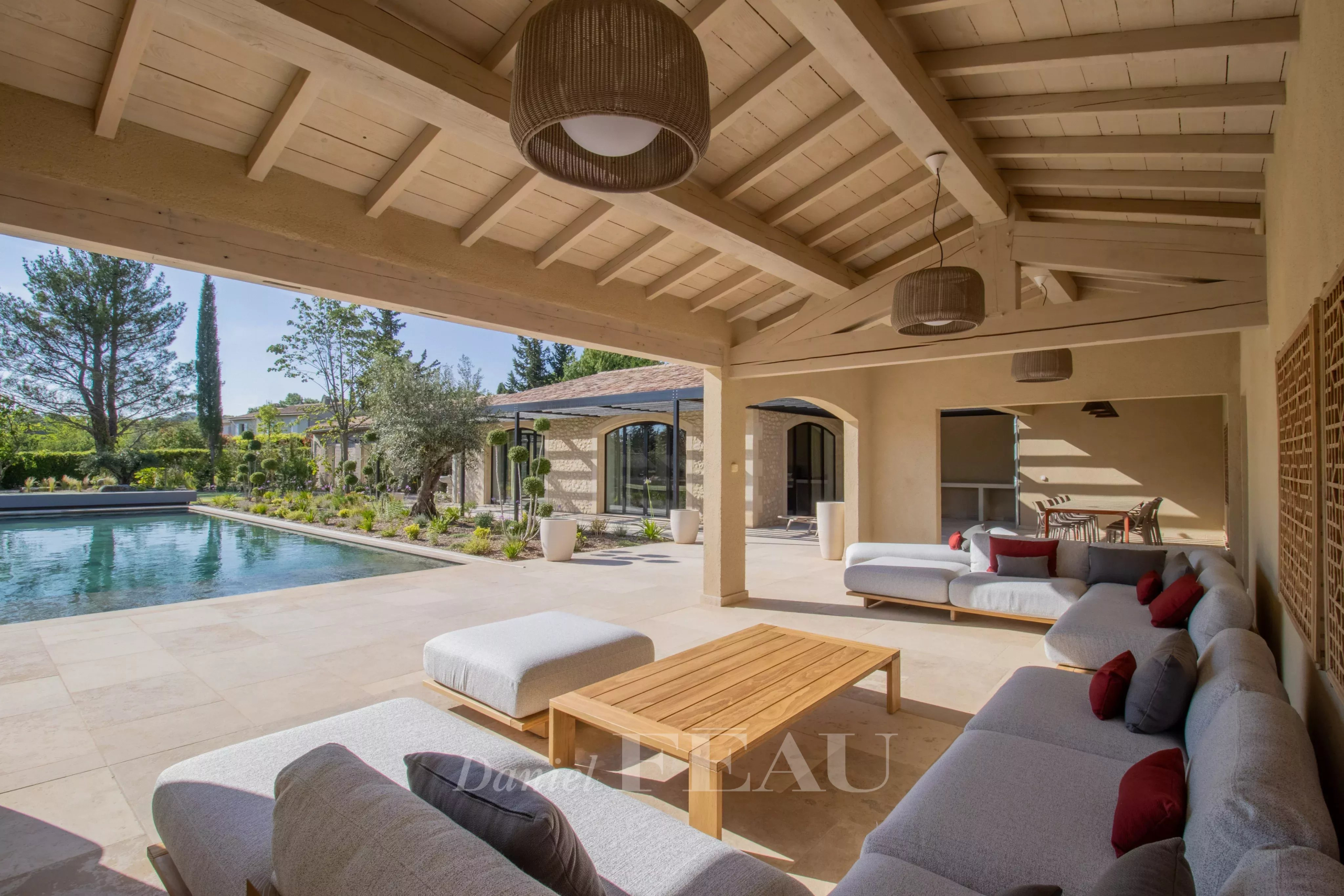 Terrace of a renovated stone house with swimming pool in Maussane-les-Alpilles.
