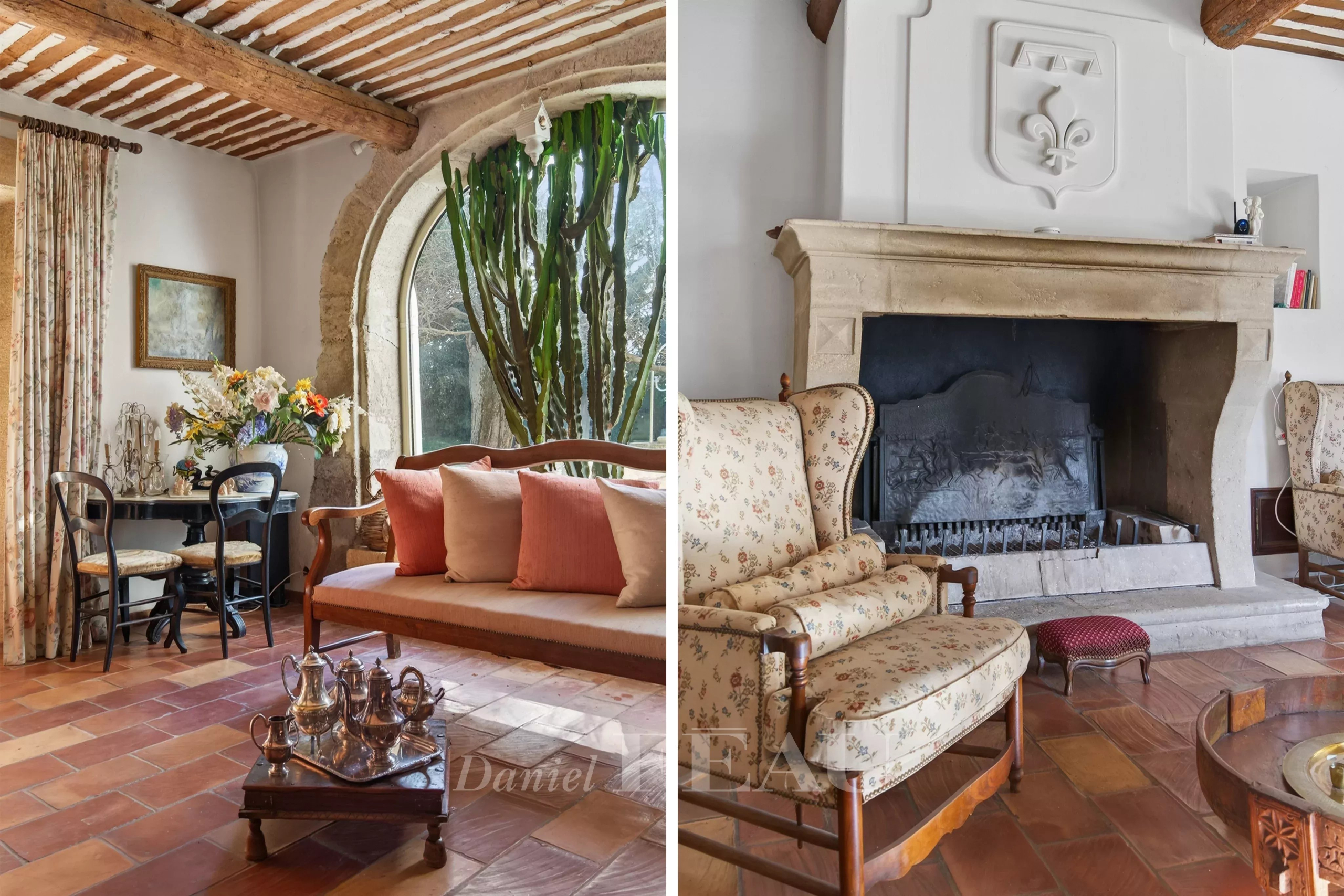 Interior of a Provençal farmhouse with fireplace and comfortable living room in Cavaillon.