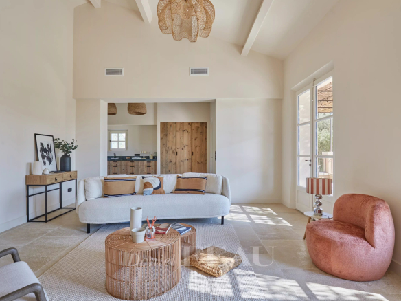 Interior of a renovated house with bright living room and open kitchen, Paradou.