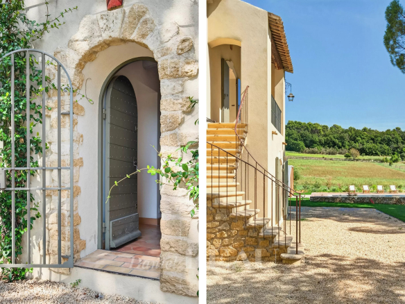Entrée d'une propriété rénovée à Lourmarin avec un portail en fer et un escalier menant à la maison.