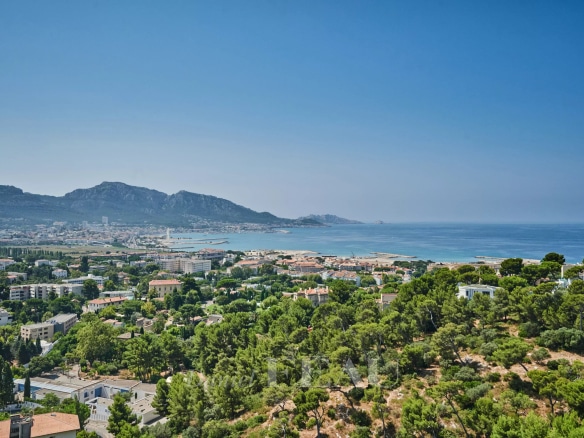 Panoramic view of the sea and the city of Marseille from a top floor apartment.