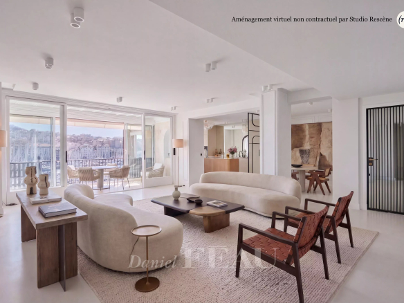 Intérieur d'un appartement rénové avec vue sur le Vieux-Port à Marseille, lumineux et moderne.
