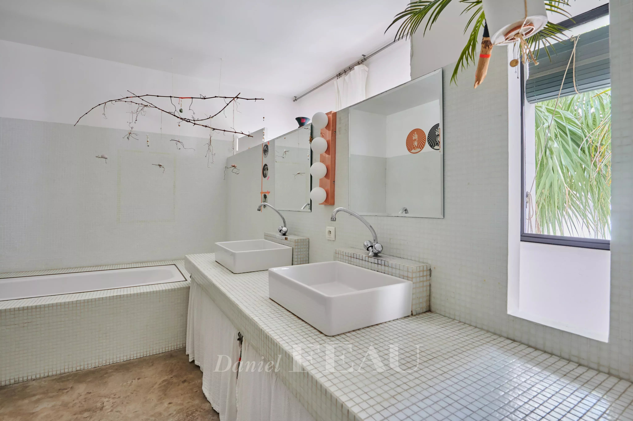 Contemporary bathroom Modern bathroom with bathtub and double sink, mosaic tiled walls.