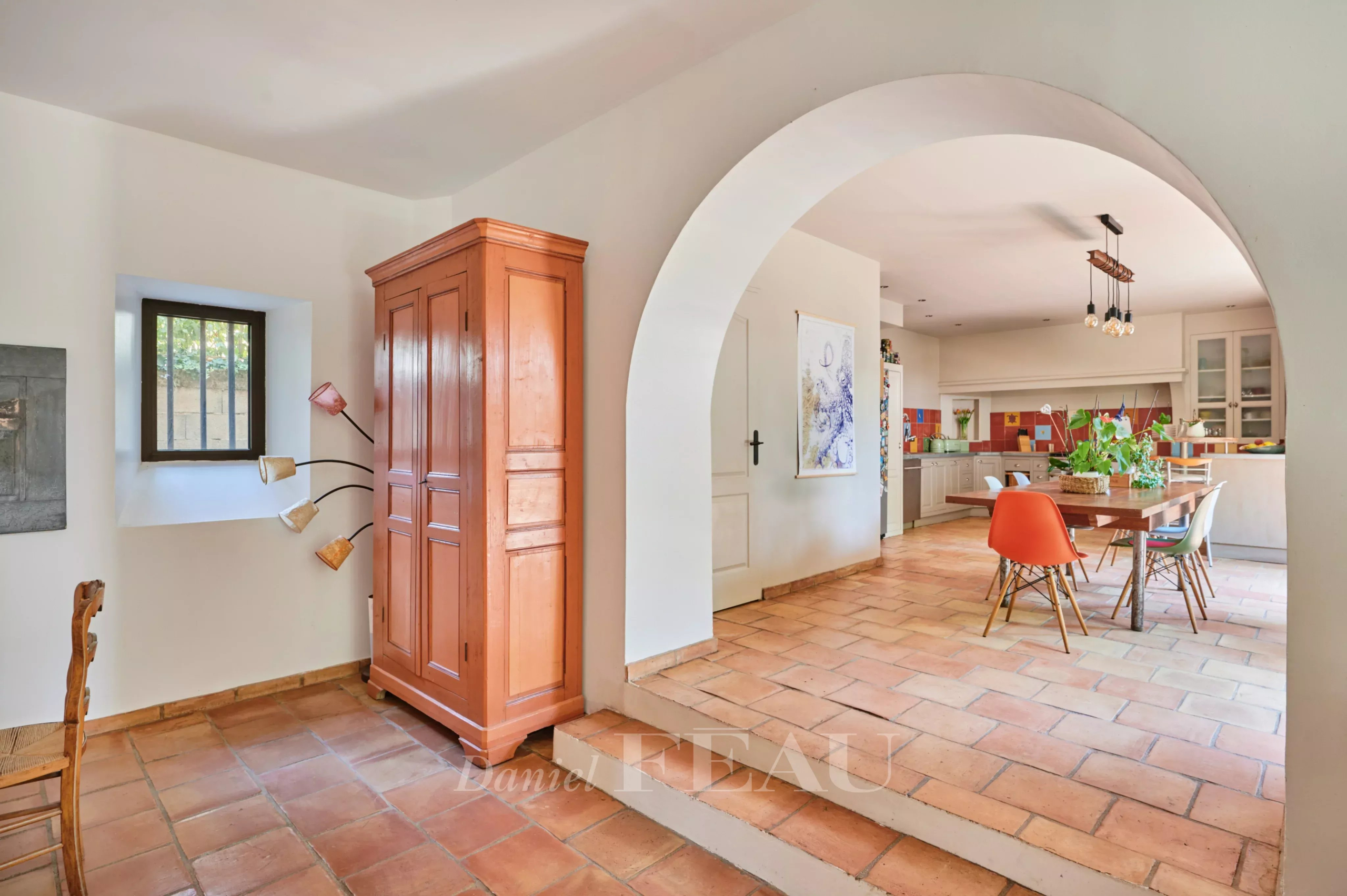 Interior of a charming house in Marseille Interior of a charming house with tiled floors and wooden furniture, Marseille