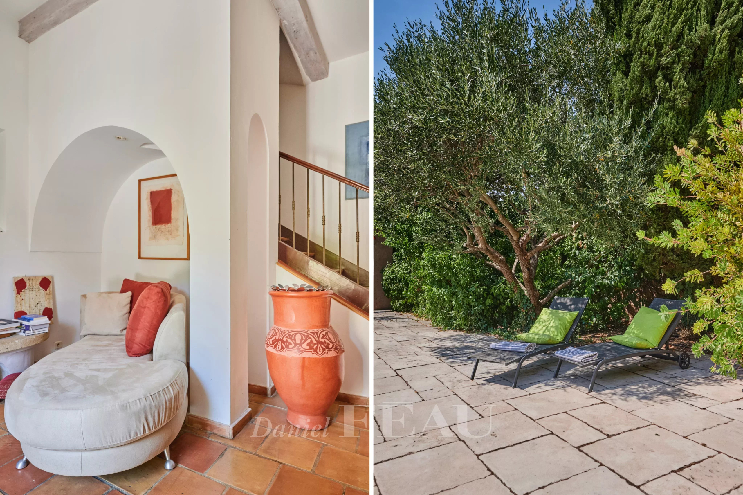 Charming house in Marseille Interior of a house with a sitting area and an outdoor garden with sun loungers.