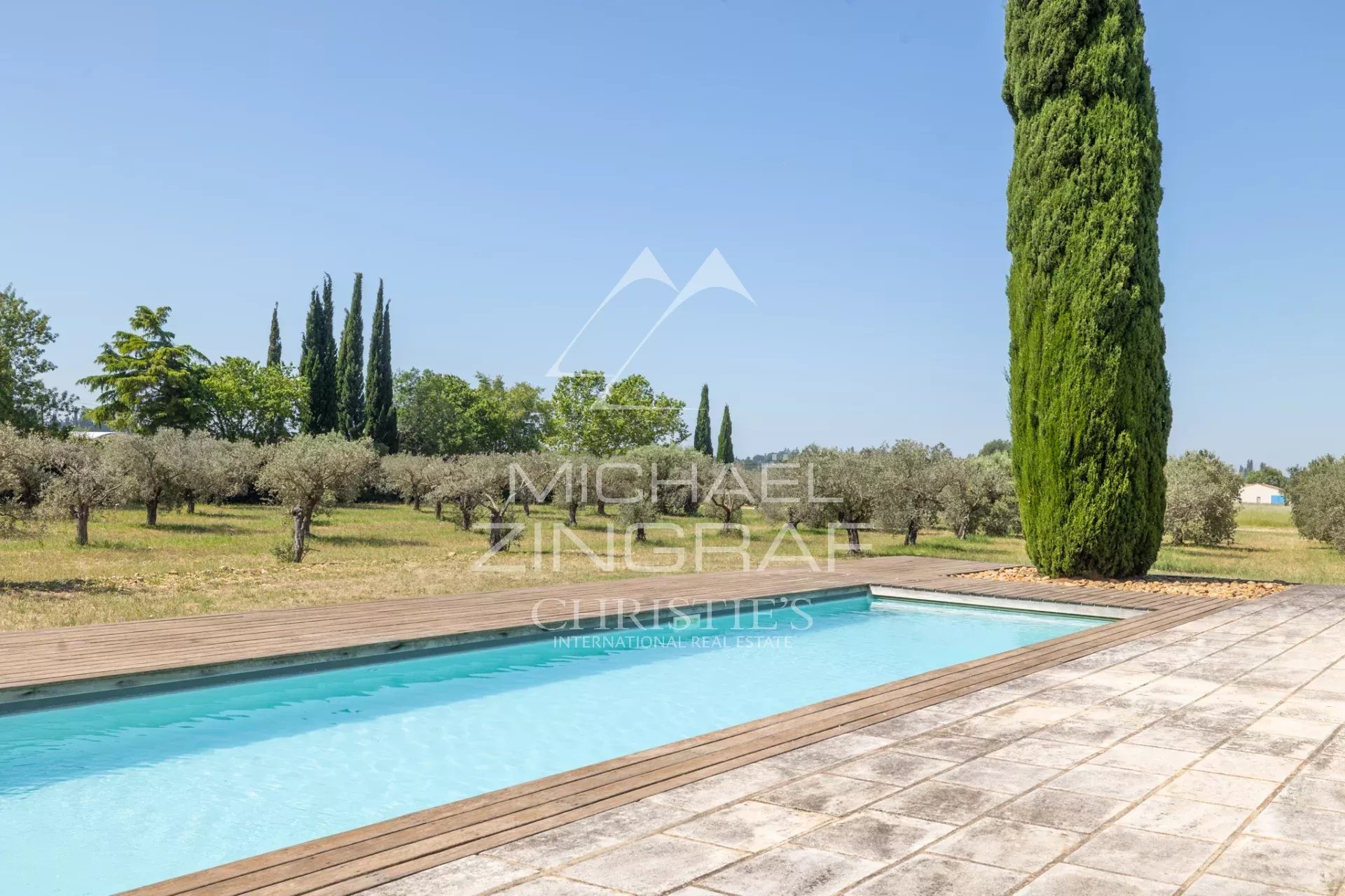Property with swimming pool near Arles Swimming pool surrounded by olive and cypress trees on a property near Arles.