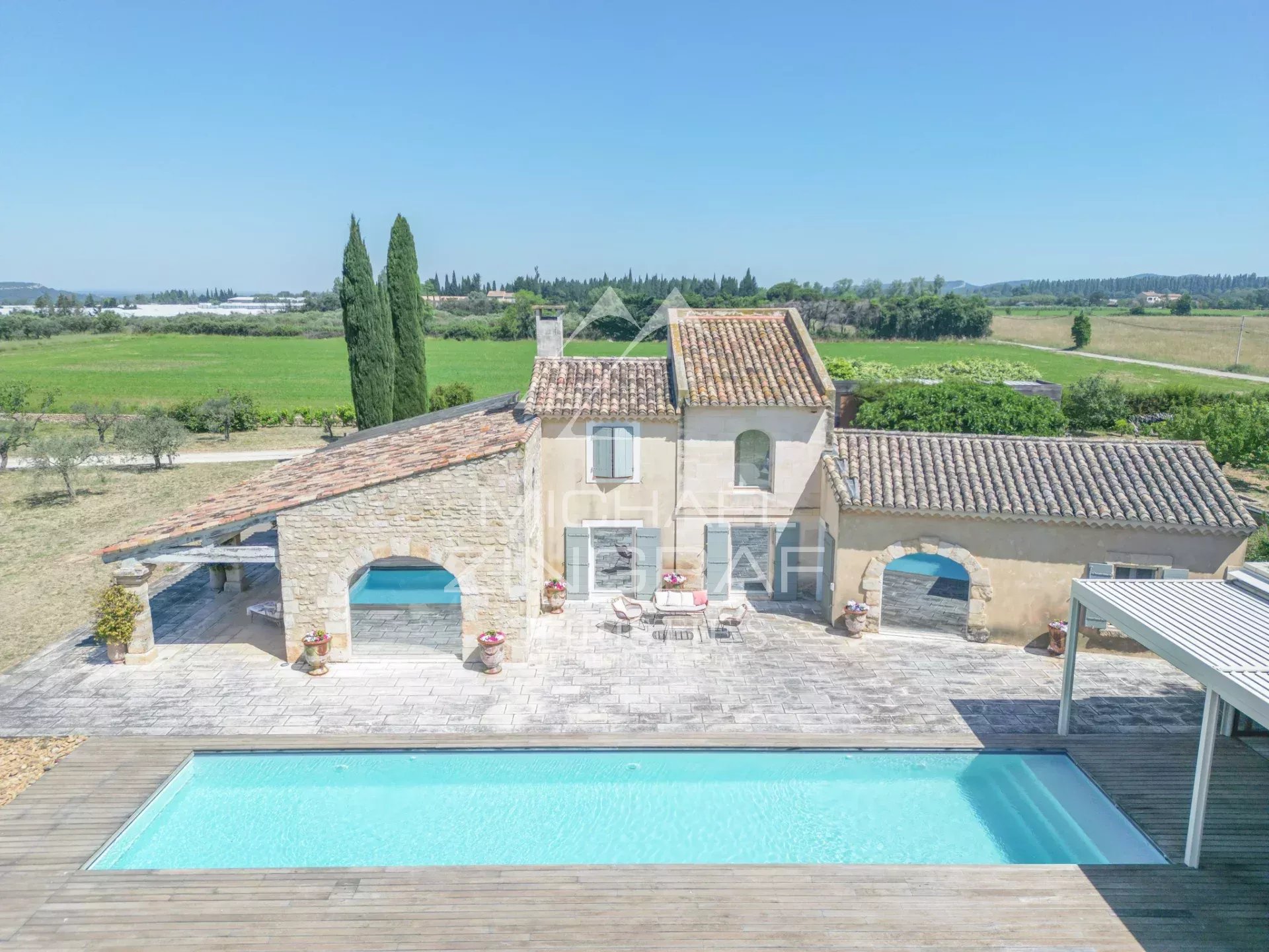 Exceptional property near Arles Aerial view of a property with swimming pool and garden, near Arles, Provence.