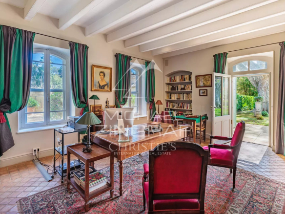 Interior of a Provençal property with bright windows and refined decor.