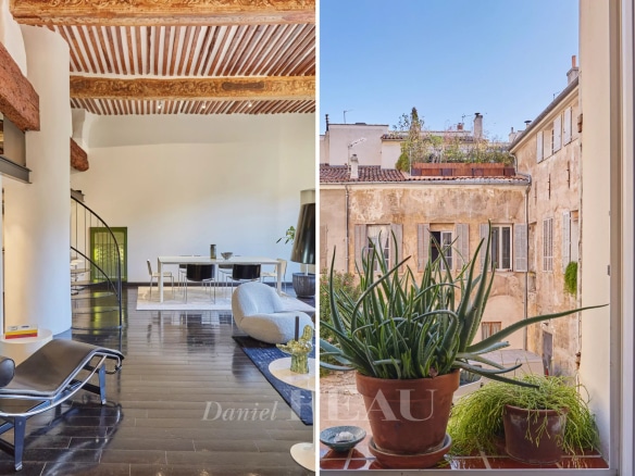Intérieur d'un appartement rénové avec poutres apparentes et mezzanine à Aix-en-Provence.