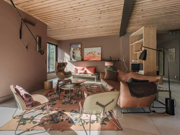 Interior of a modern architect-designed house with a bright living room and contemporary furniture.
