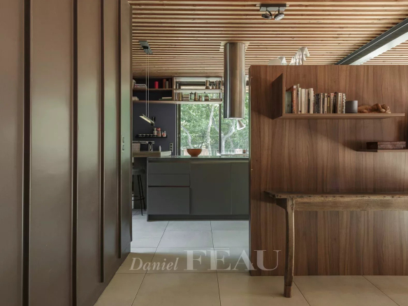 Interior of a modern architect-designed house with open kitchen and contemporary decor.