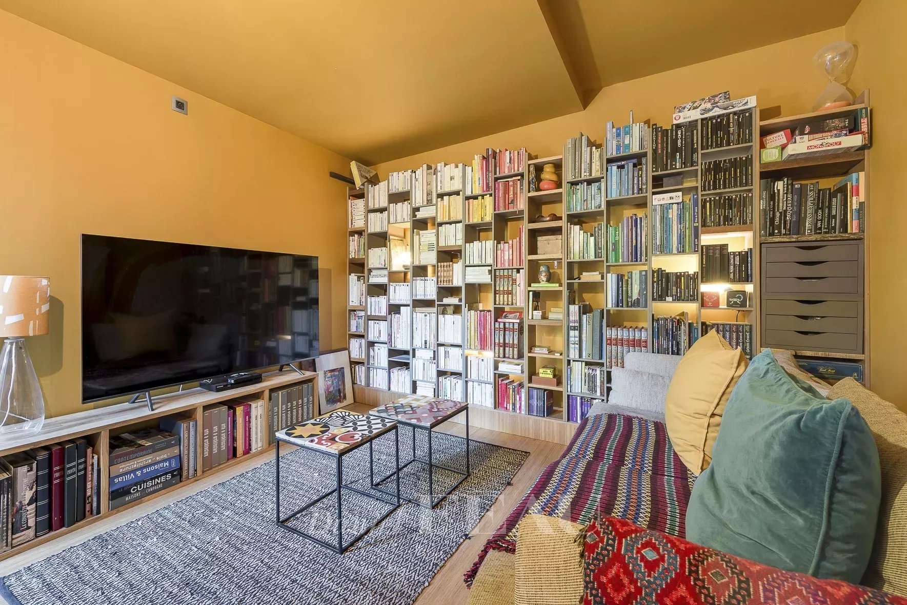 Interior of an architect-designed house Interior of an architect-designed house with a library and comfortable living room.
