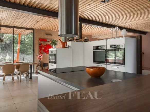 Interior of a modern architect-designed house with open kitchen and dining room, Aix-en-Provence.