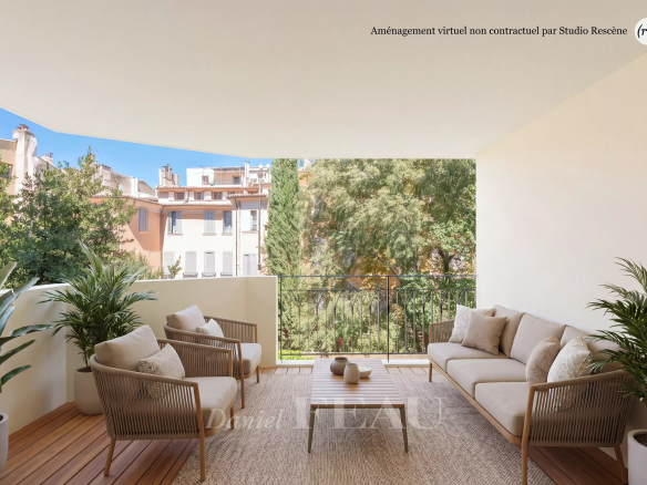 Terrasse d'un appartement à Aix-en-Provence avec mobilier moderne et vue sur la ville.