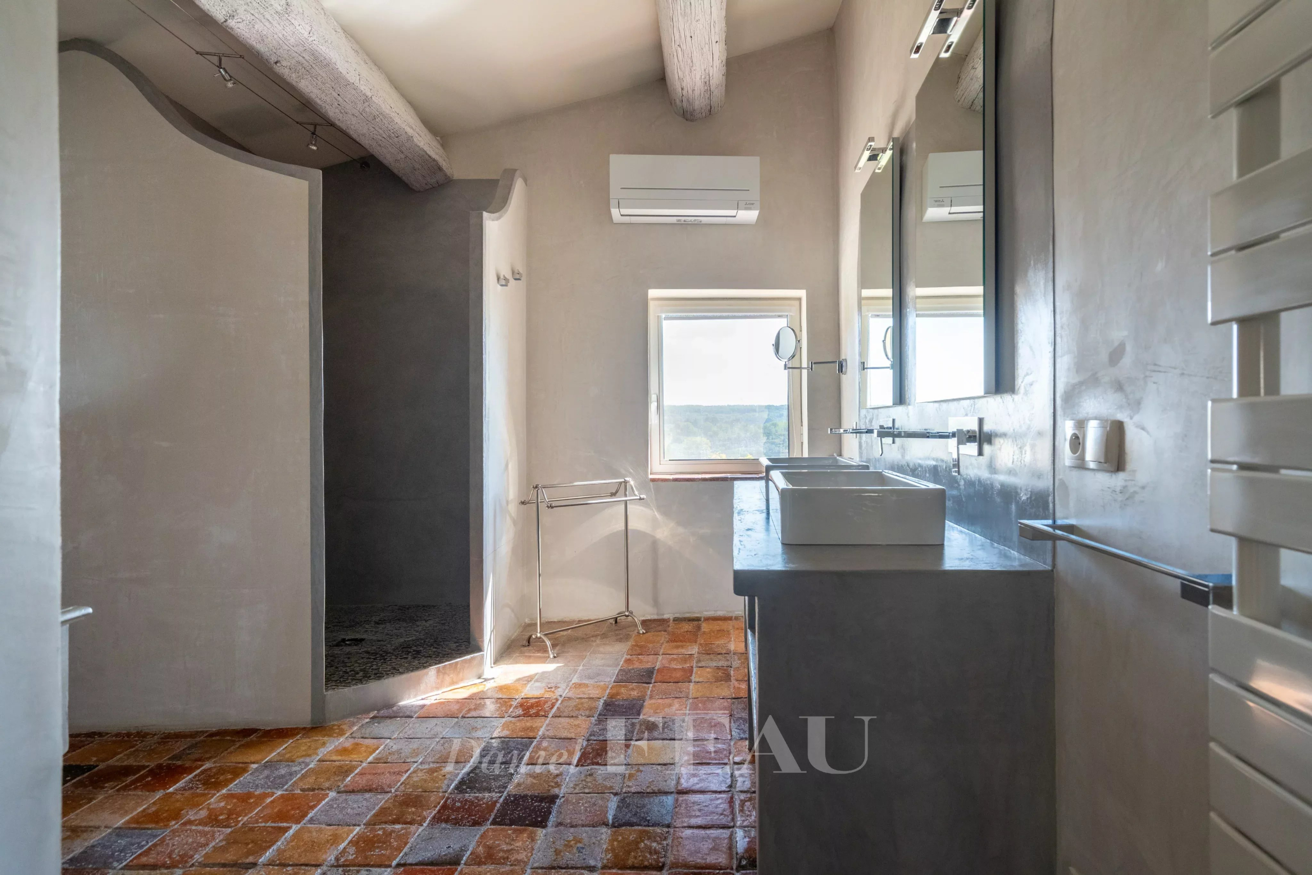 Bathroom of a former rectory Modern bathroom with shower and views of nature, in an 18th century stone house.