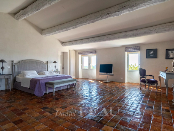 Spacious room with terracotta tiles and views of nature, in an 18th century stone house.