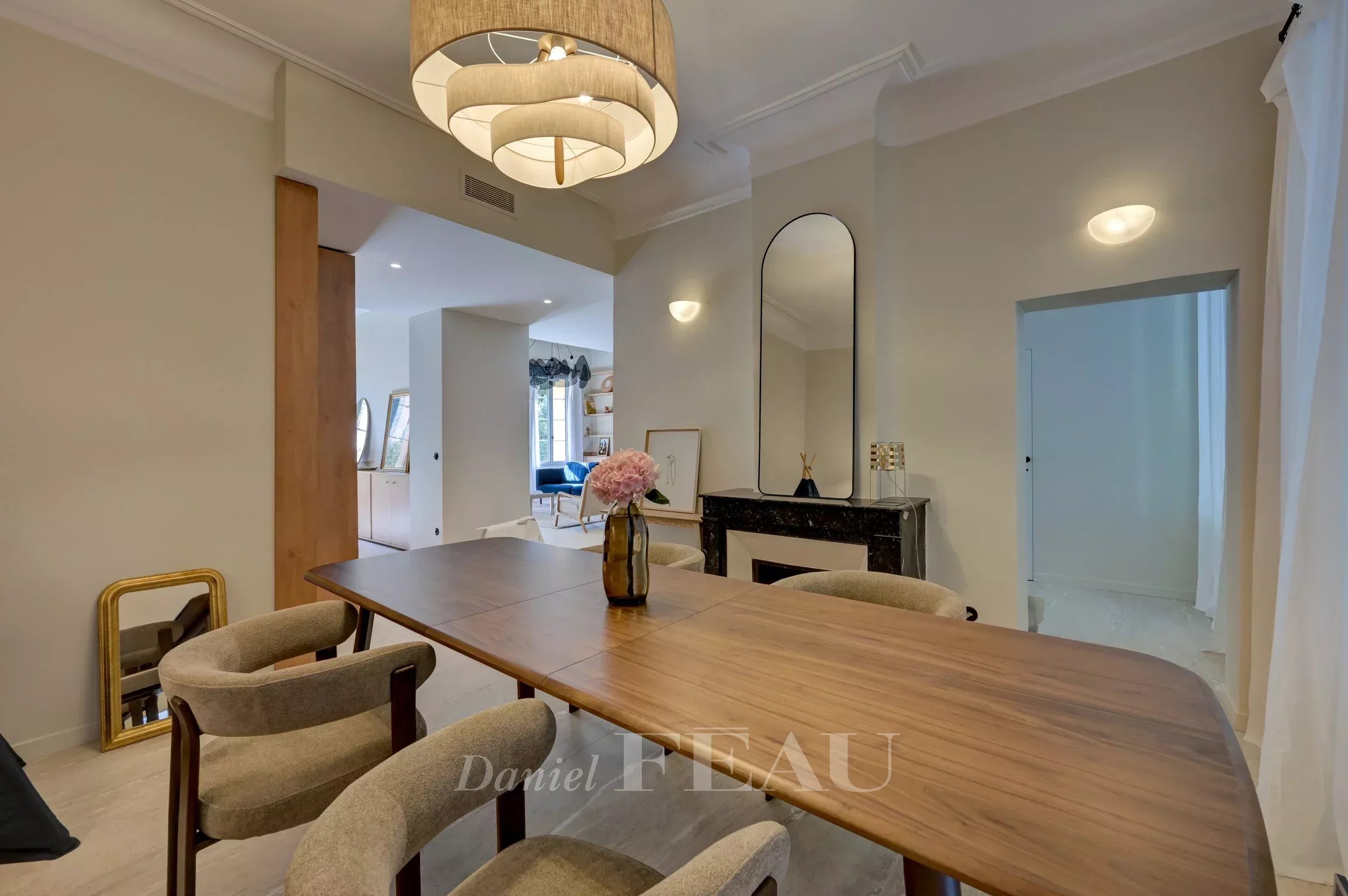 Renovated duplex apartment in Aix-en-Provence Interior of a renovated duplex apartment in Aix-en-Provence, with a wooden table and modern chairs.