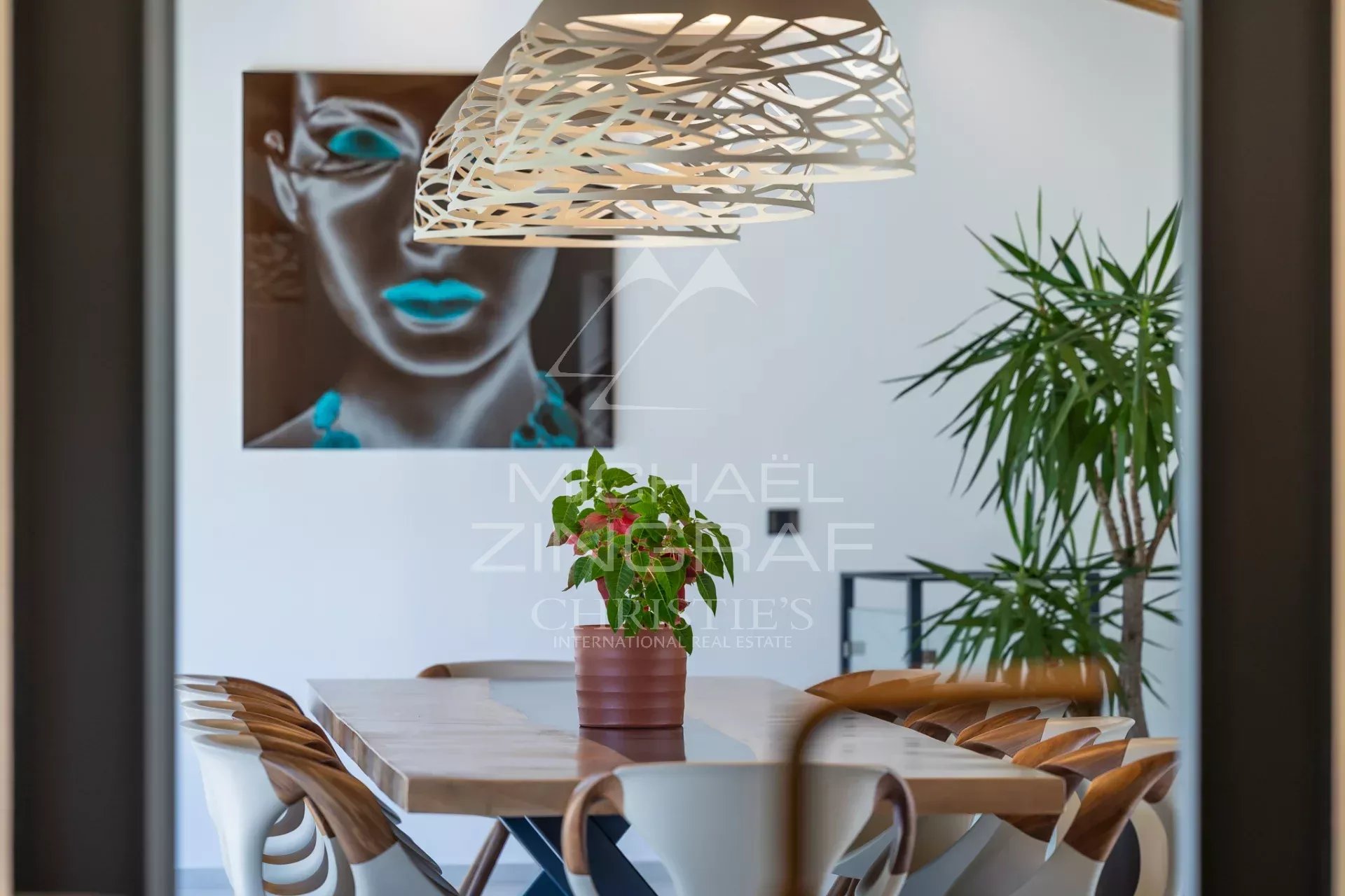Interior of an exceptional property Interior of a modern house with a dining table and contemporary decor.