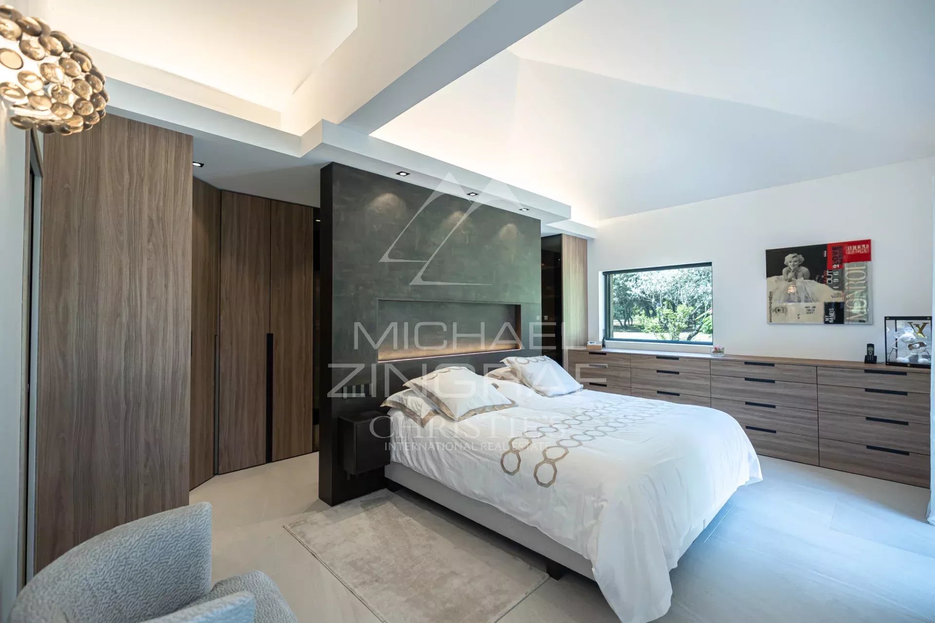 Modern room in a renovated property Modern room with double bed and wooden furniture, natural light through the windows.
