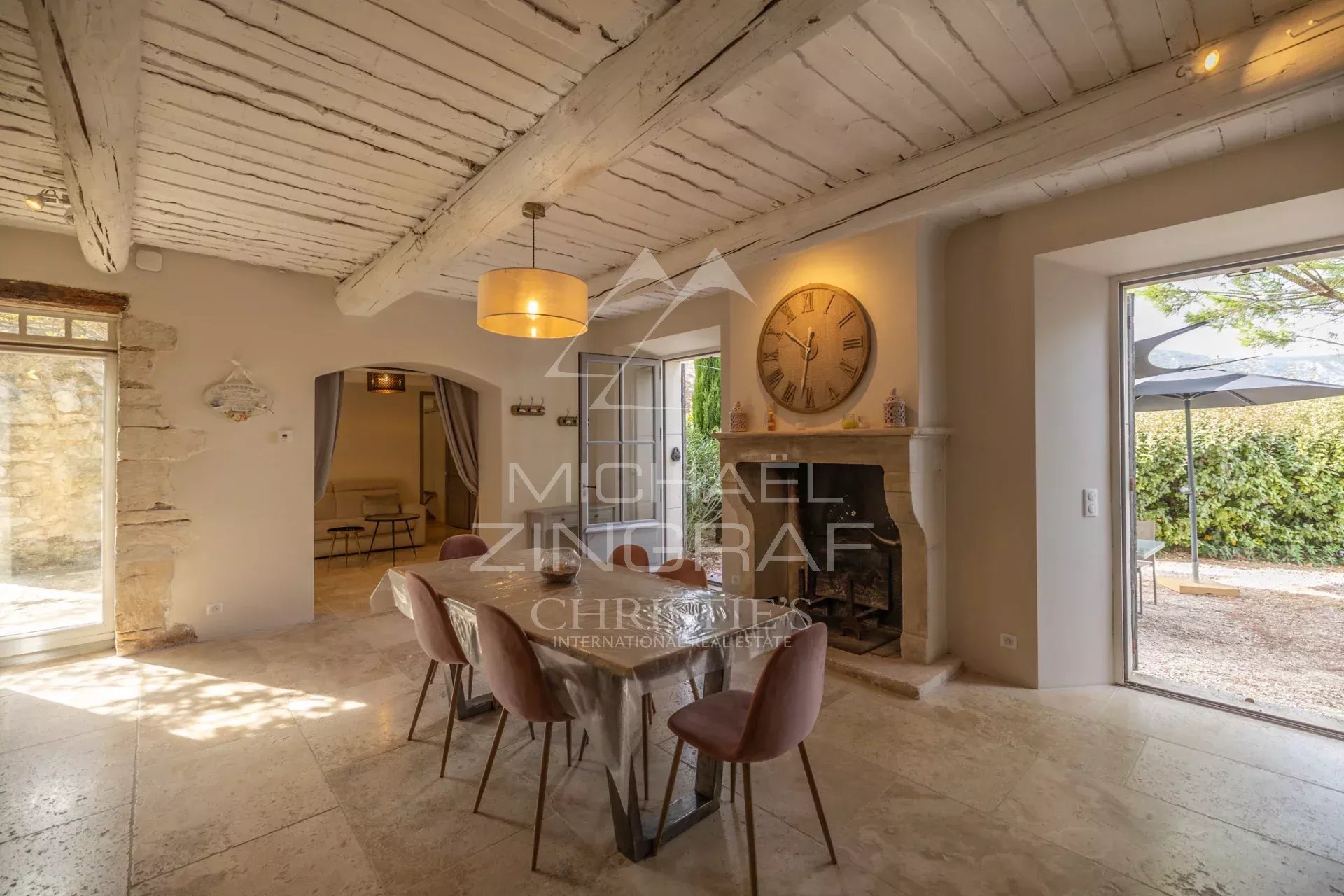 Interior of a Provençal farmhouse Interior of a Provençal farmhouse with dining room, fireplace and natural light.
