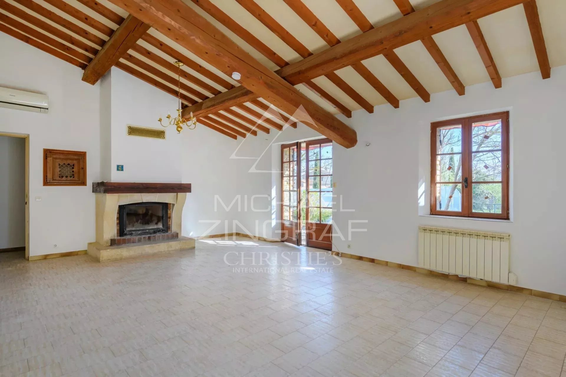 Interior of a villa to renovate in Gordes Interior of a villa to be renovated with exposed beams and fireplace, located in Gordes.