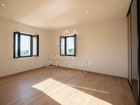 Interior of a bedroom in a contemporary villa in Gordes with natural light