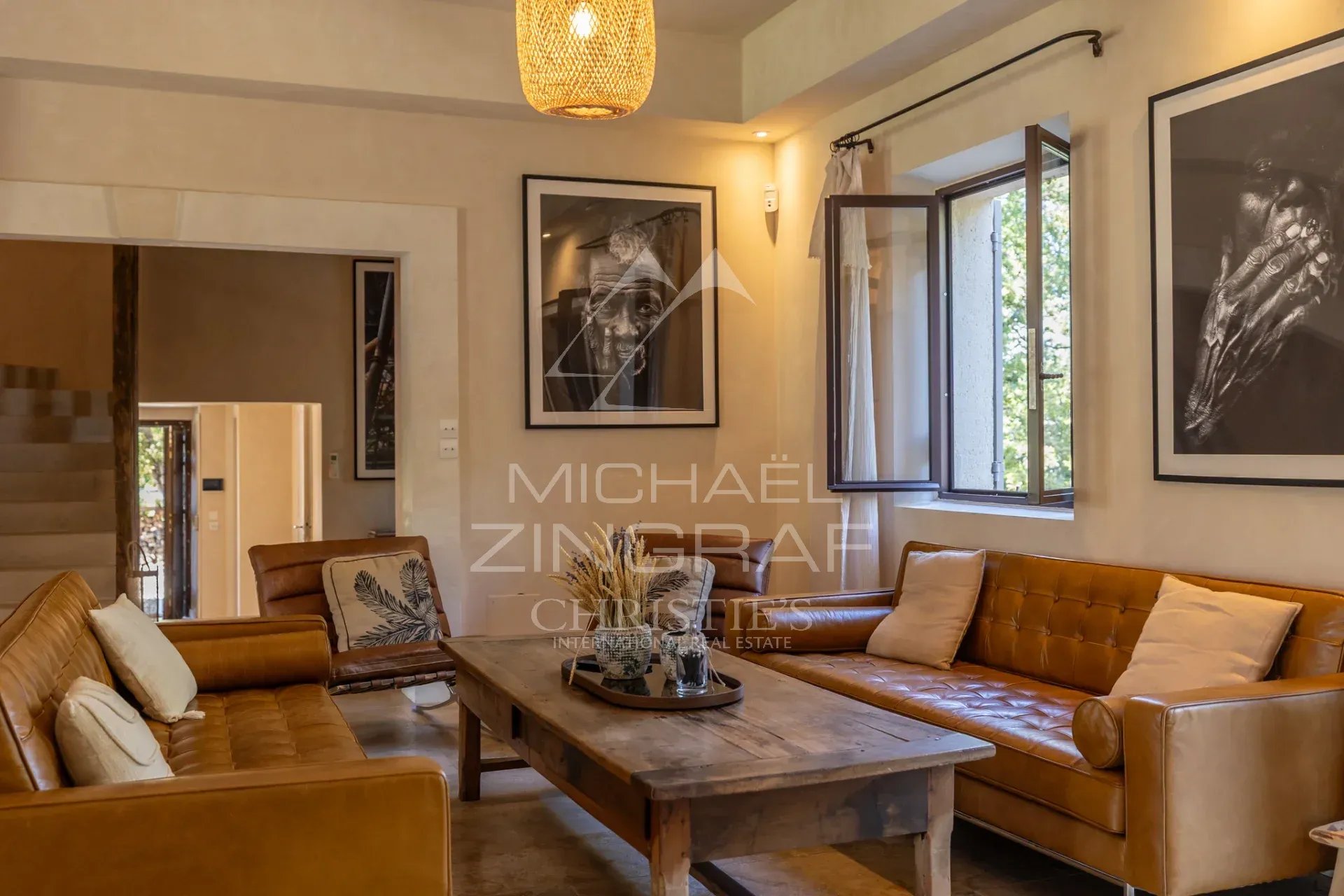 Living room of a country house in Ménerbes Interior of a Provençal country house with a bright living room and leather furniture.