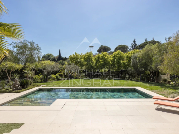 View of the swimming pool and garden of a contemporary villa in Saint-Paul-de-Vence.