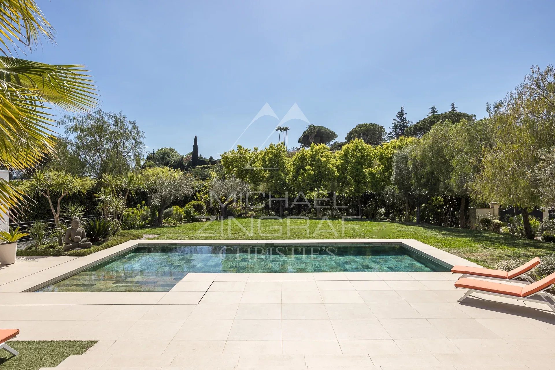 View of the swimming pool and garden of a contemporary villa in Saint-Paul-de-Vence.