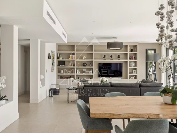 Bright interior of a contemporary villa in Saint-Paul-de-Vence with living room and dining room.