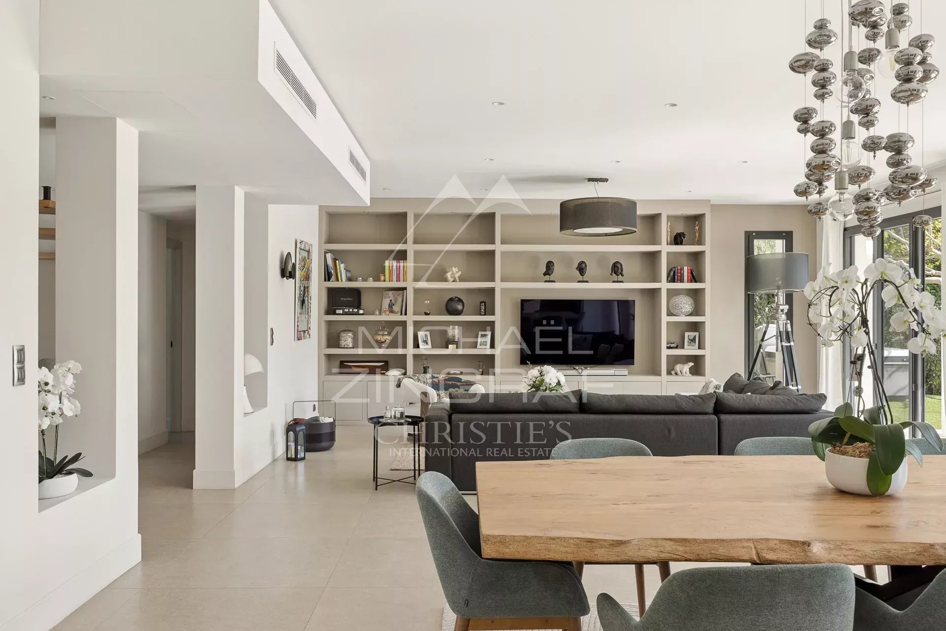 Bright interior of a contemporary villa in Saint-Paul-de-Vence with living room and dining room.