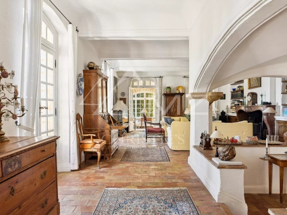 Interior of a manor house with a spacious living room and elegant decor.