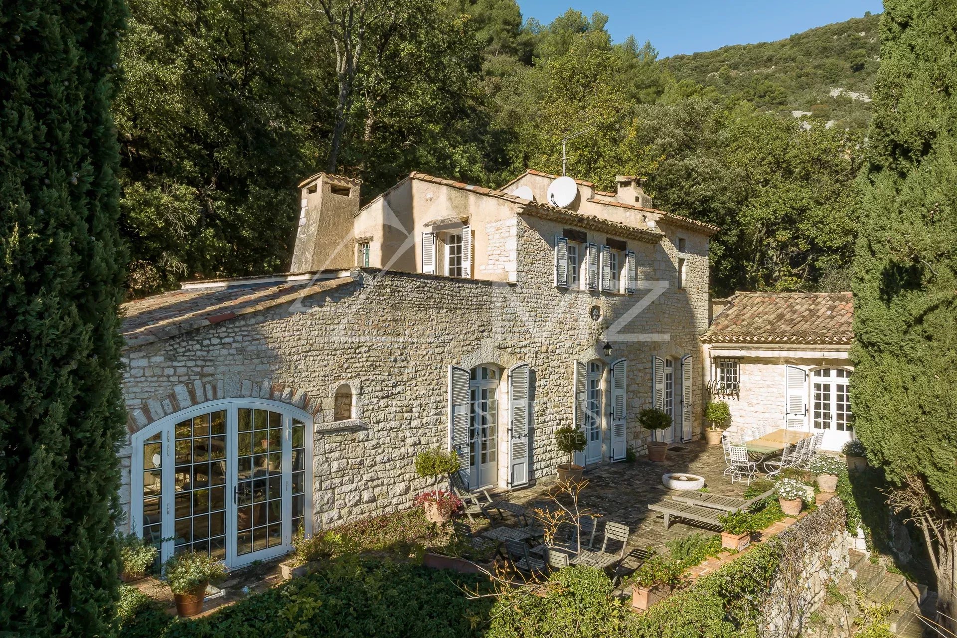 Stone manor house with garden in Tourrettes-sur-Loup, surrounded by trees