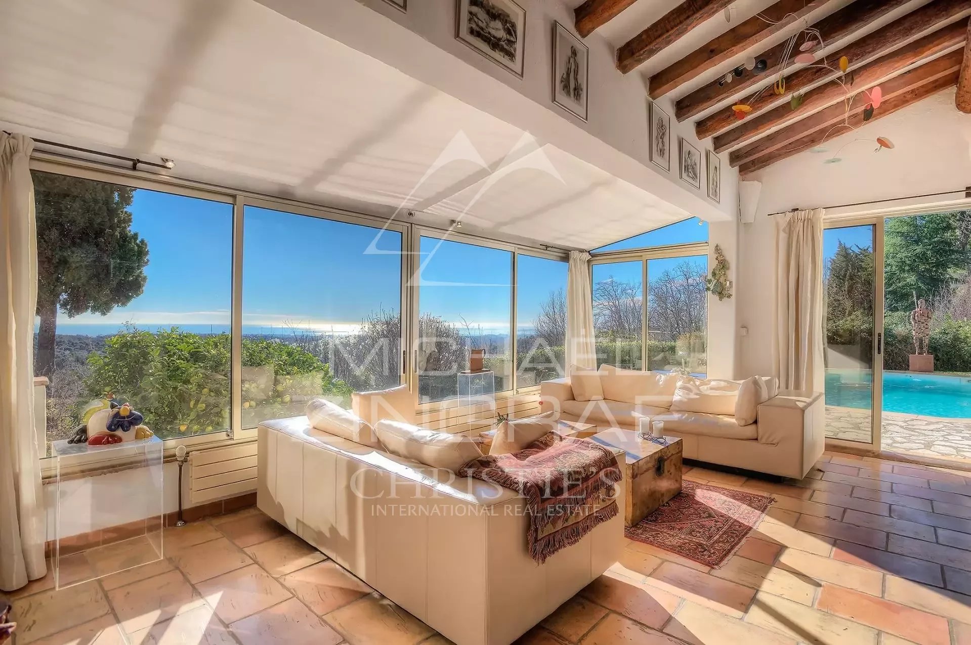 Bright living room with sea view in Vence Interior of a Provençal villa in Vence with sea view, bright living room and swimming pool.